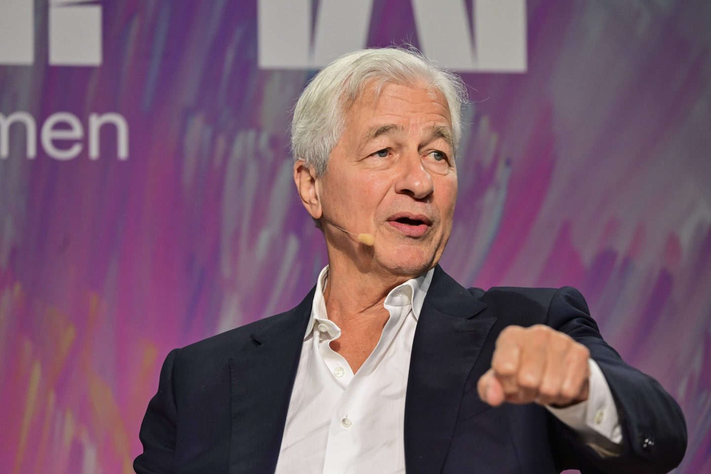 Jamie Dimon with his hand up at Fortune's Most Powerful Women Summit