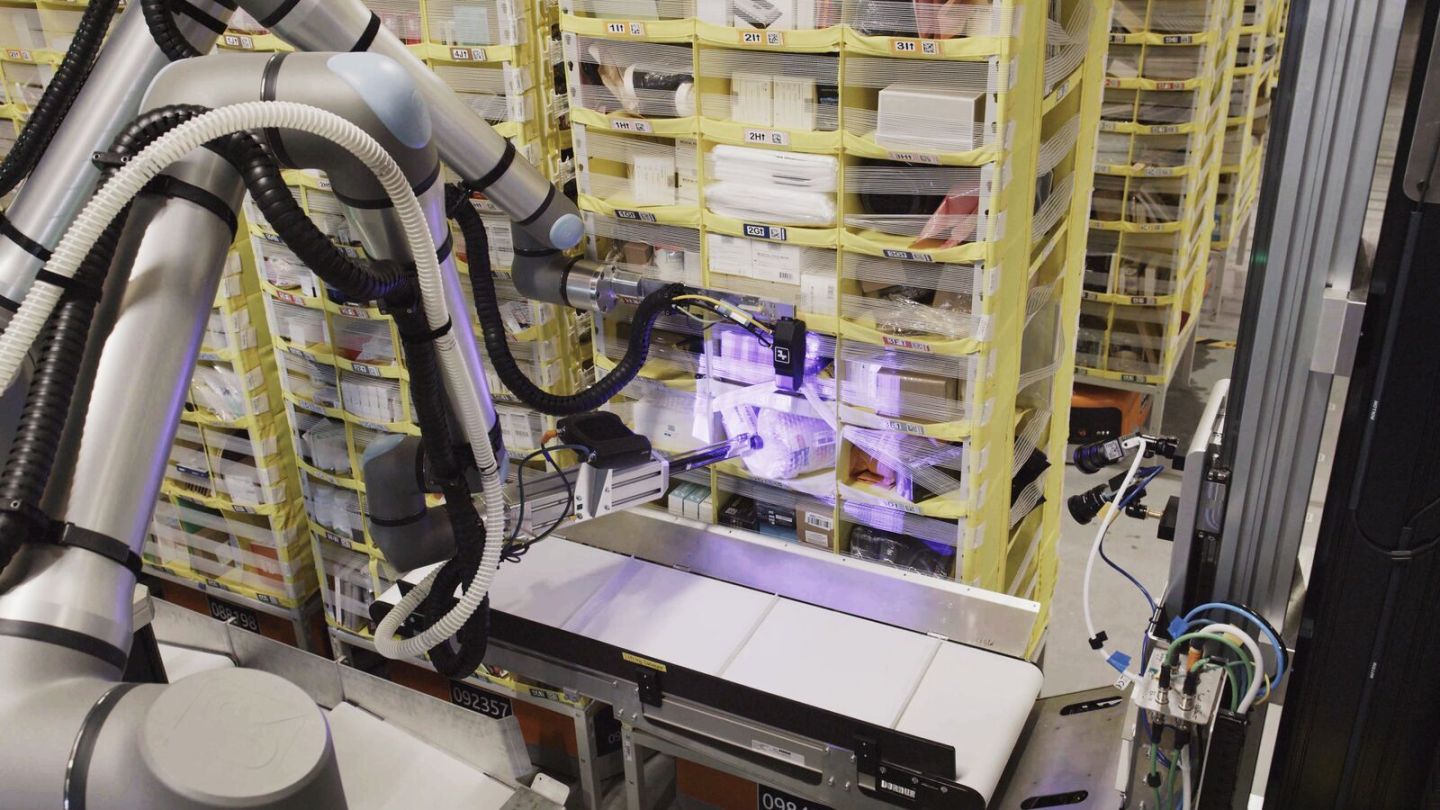 Amazon's Vulcan robot uses an arm with a camera and a suction cup to pick items from the retailer's warehouse storage pods. (Photo courtesy Amazon)