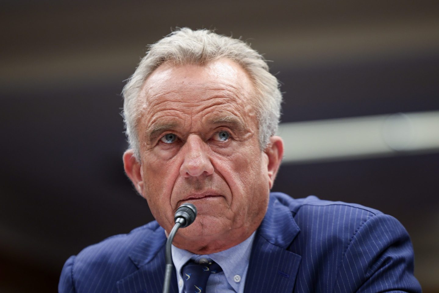 RFK Jr. speaks into a microphone