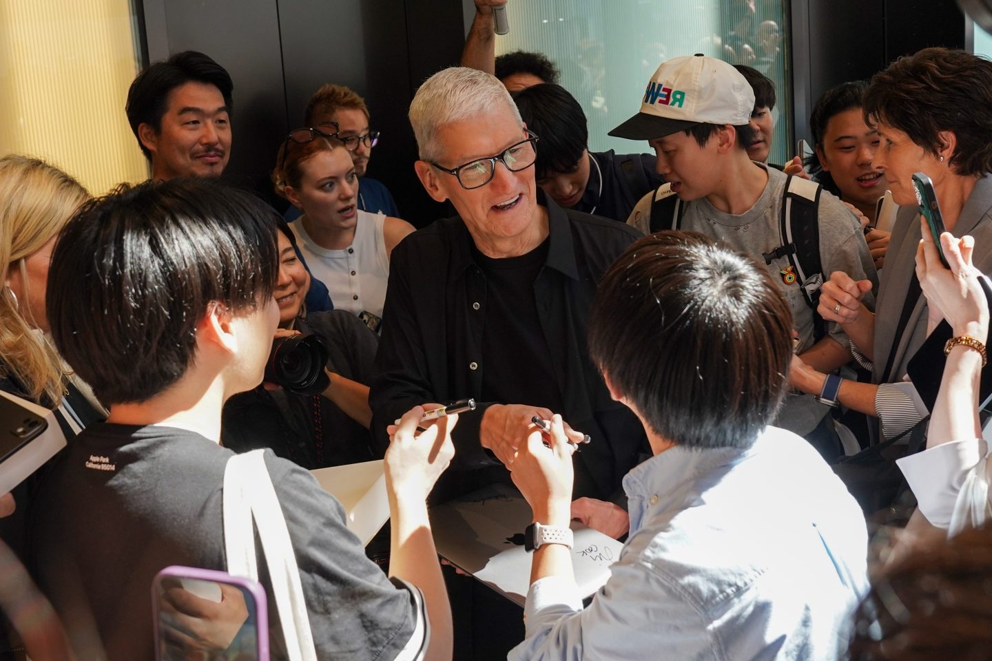 Tim Cook greets Apple Store customers in Japan