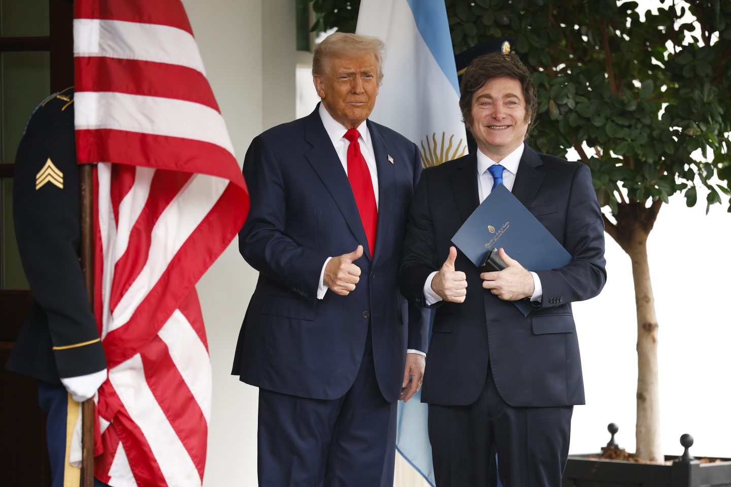 U.S. President Donald Trump (L) greets President of Argentina Javier Milei as he arrives at the West Wing of the White House on October 14, 2025 in Washington, DC.