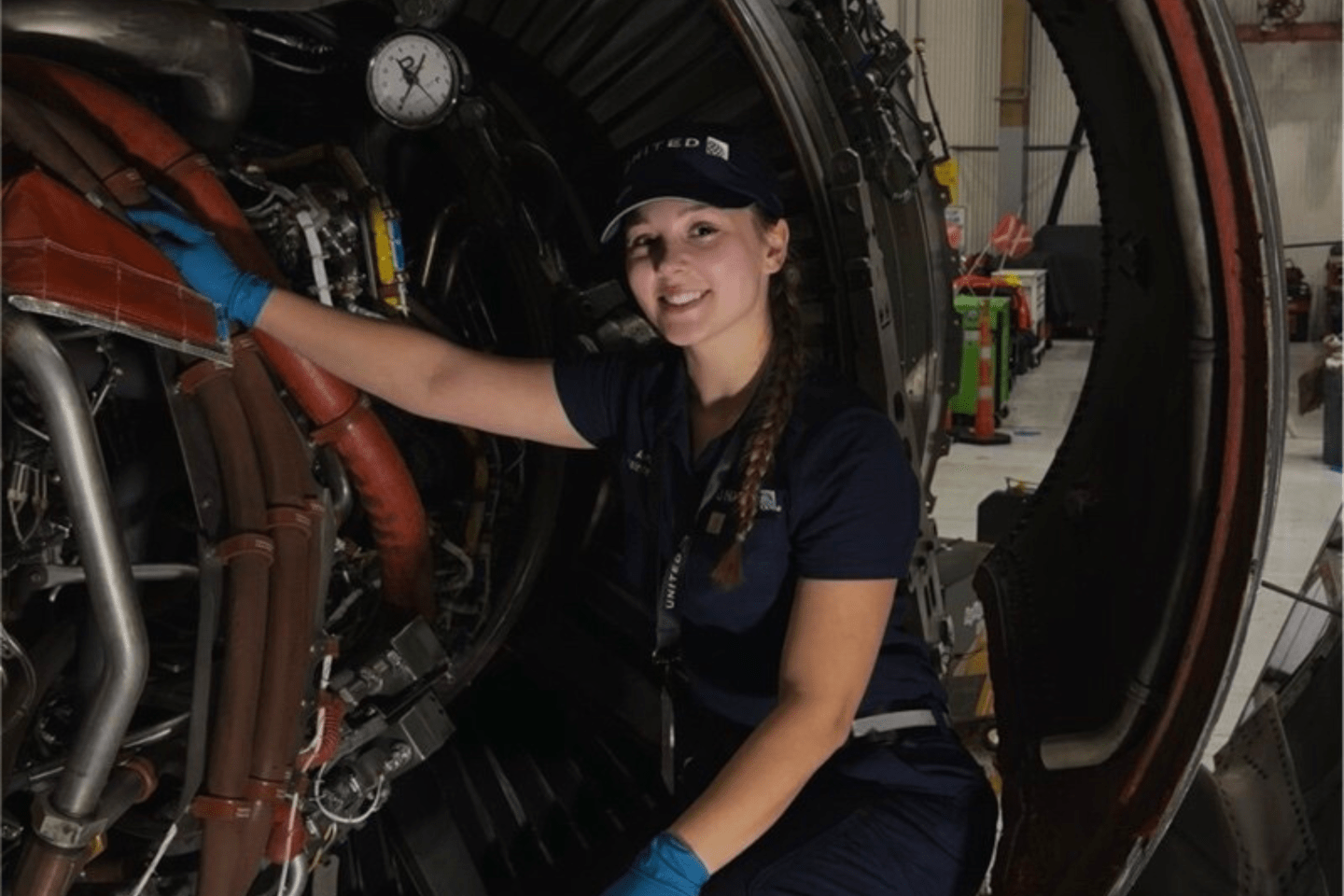 Bianca Miller behind a jet engine